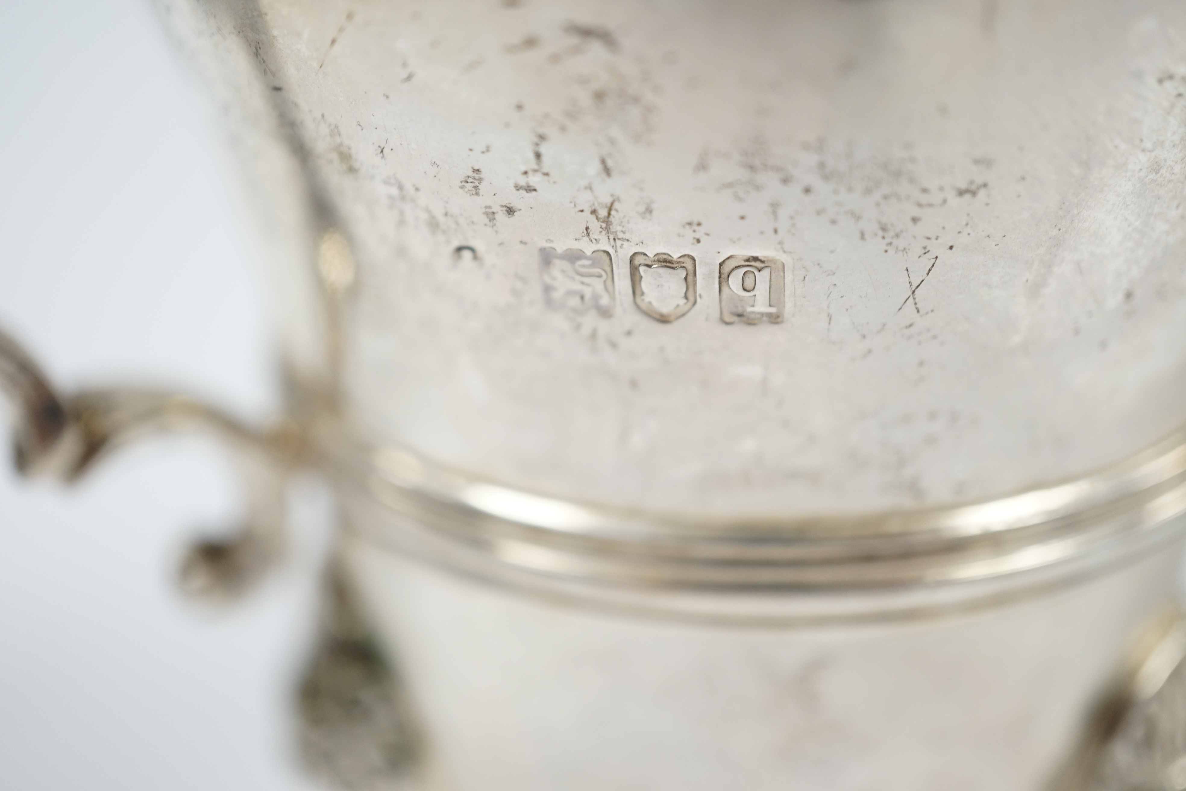 A George V silver cream jug, London 1911, height 11.5cm, 8.1oz. Condition - fair to good